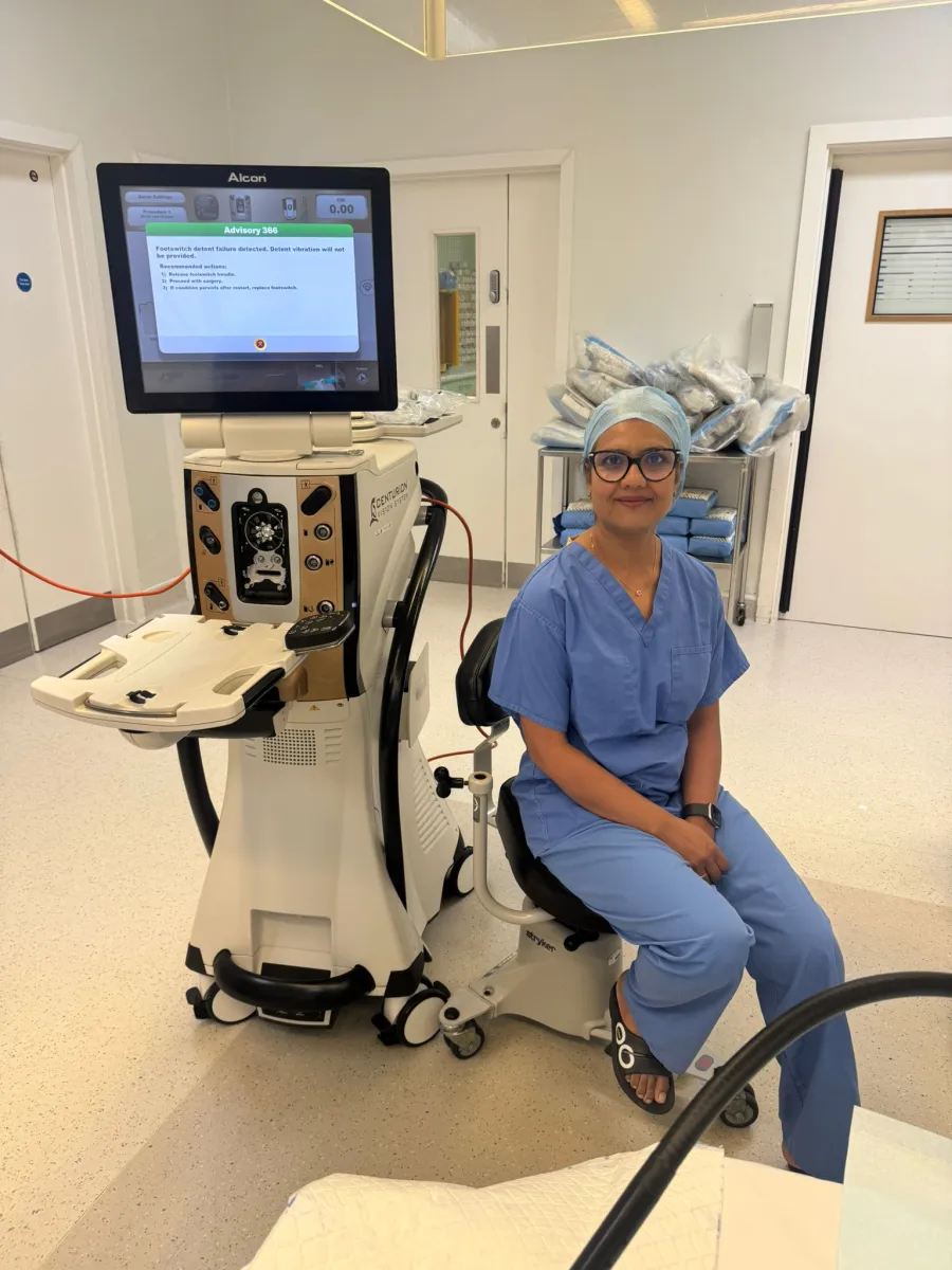 Miss Anita Paul in surgical scrubs with the Alcon cataract surgery system